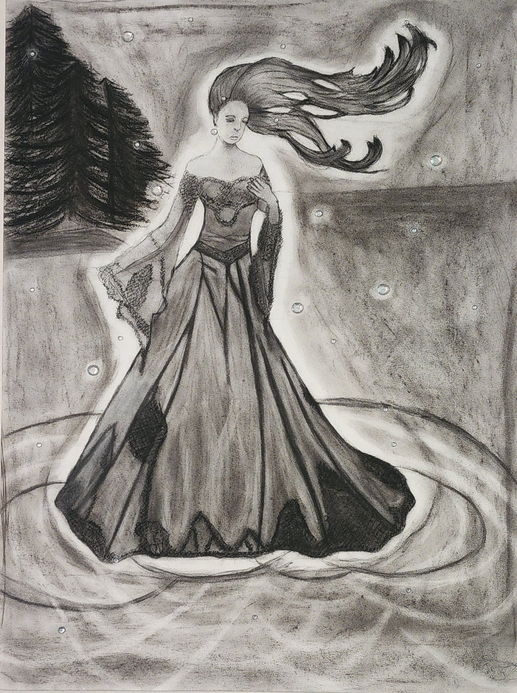 A charcoal drawing of a woman in a flowing dress with a dramatic pose, accompanied by charcoal gems scattered around.