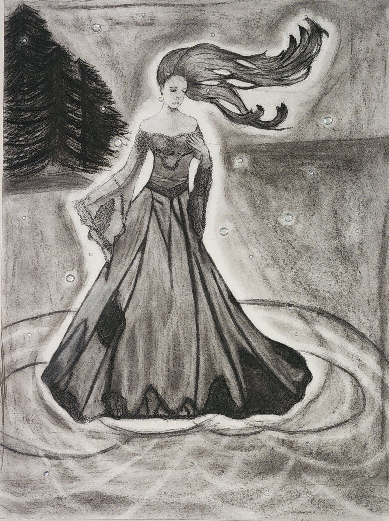 A charcoal drawing of a woman in a flowing dress with a dramatic pose, accompanied by charcoal gems scattered around.